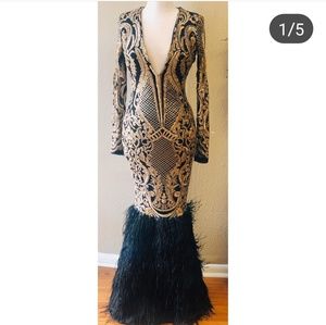 Black and gold sequin mermaid dress with ostrich f